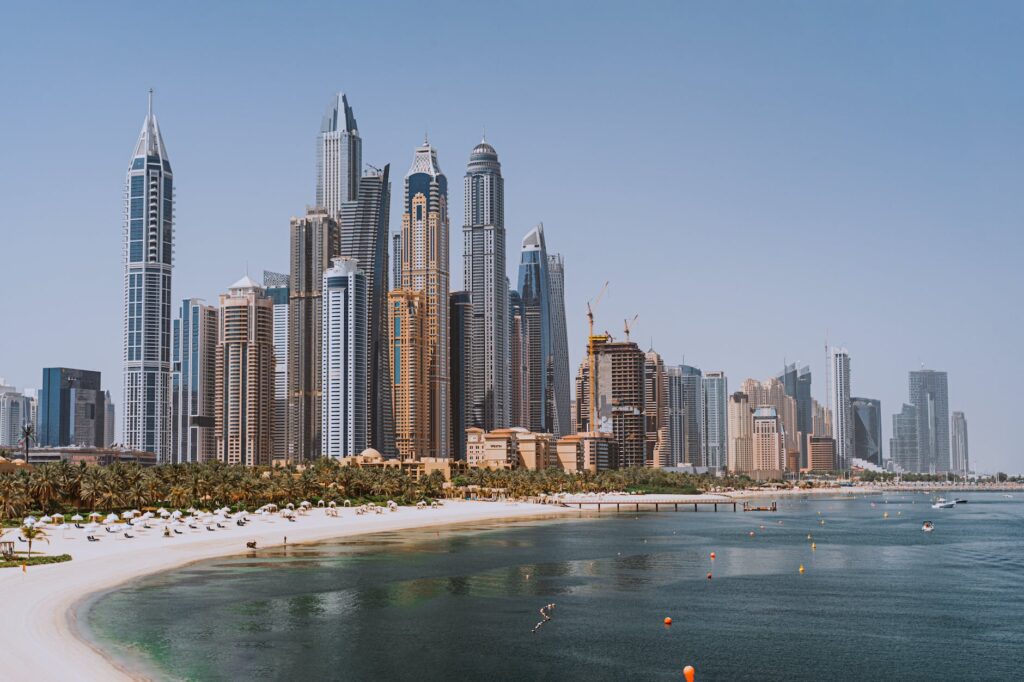 high rise buildings and skyscrapers near a body of water