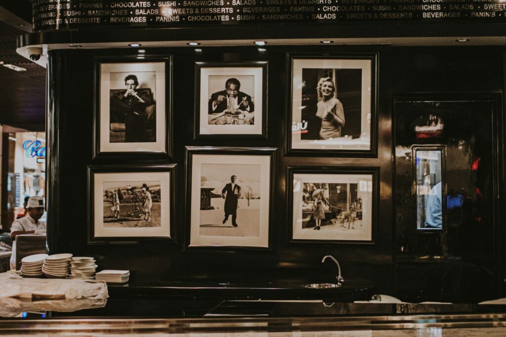 pictures in black and white on wall in restaurant